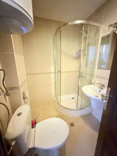 Compact bathroom with shower enclosure in Bay View Villas, Kosharitsa, Bulgaria.