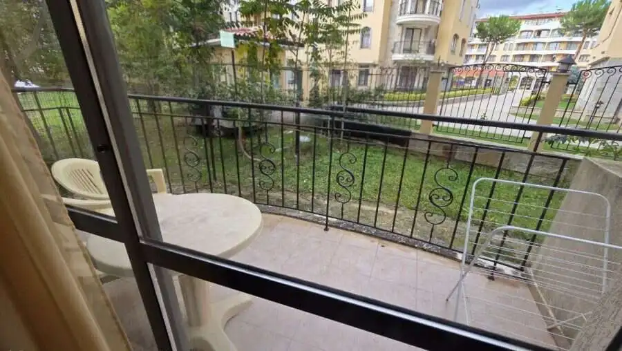 Elegant studio apartment balcony in Sunny Beach Balcony view of Avalon**** in Sunny Beach with outdoor seating and garden scenery.