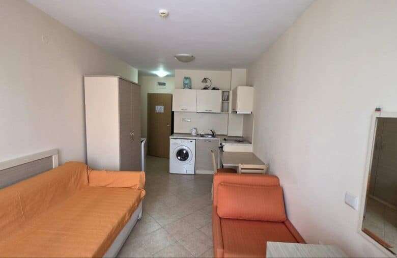 Interior view of a compact studio apartment near the sea in Royal Sun.