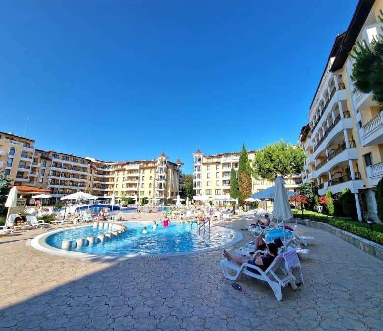 Bright outdoor pool area at Royal Sun complex, close to the sea.