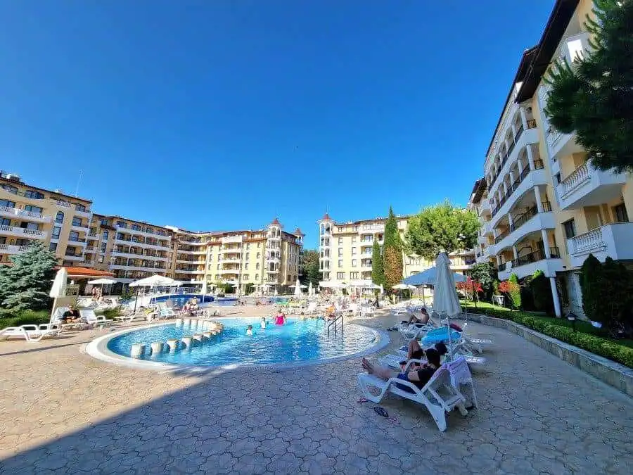 Bright outdoor pool area at Royal Sun complex, close to the sea.