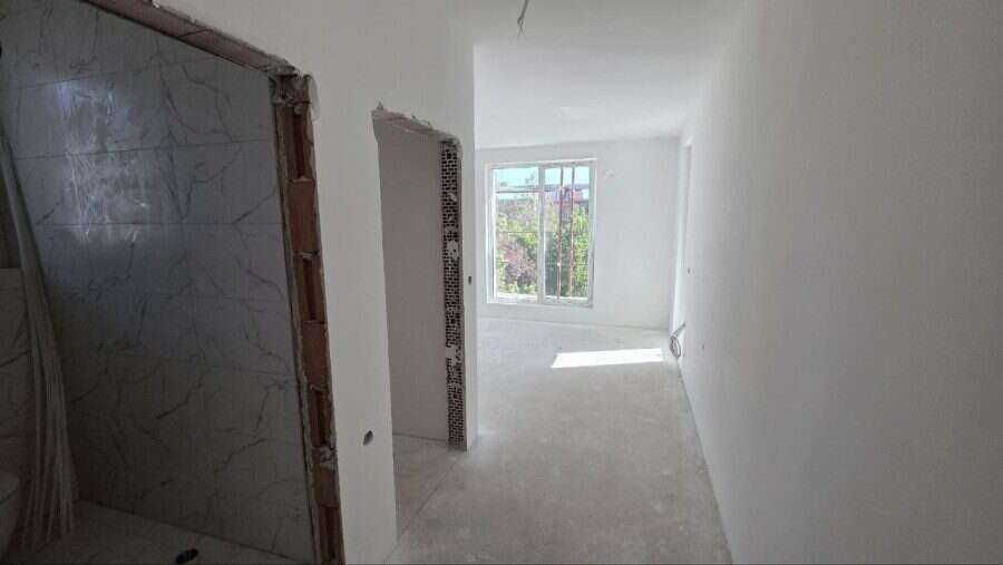 Bright, unfurnished studio apartment in La Mer Silver Residence 2, just 500m from the sea in Sunny B.