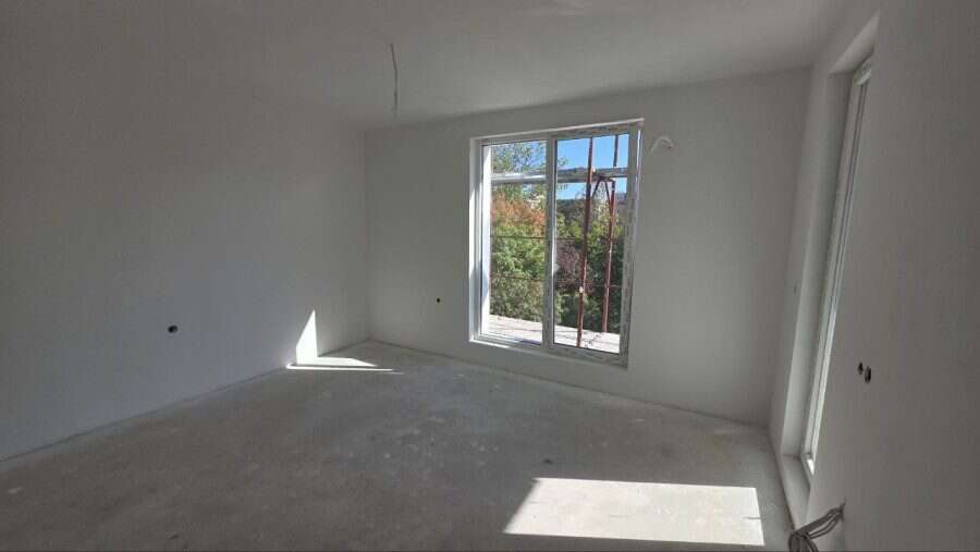 Bright empty studio with large window near Sunny Beach, Bulgaria.