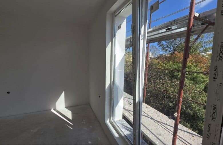 Bright empty studio with large window in La Mer Silver Residence, Sunny Beach.