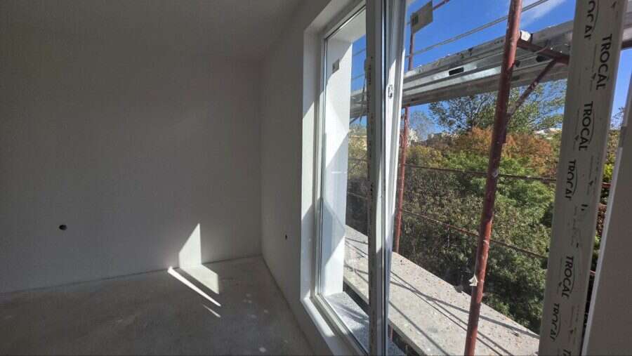 Bright empty studio with large window in La Mer Silver Residence, Sunny Beach.