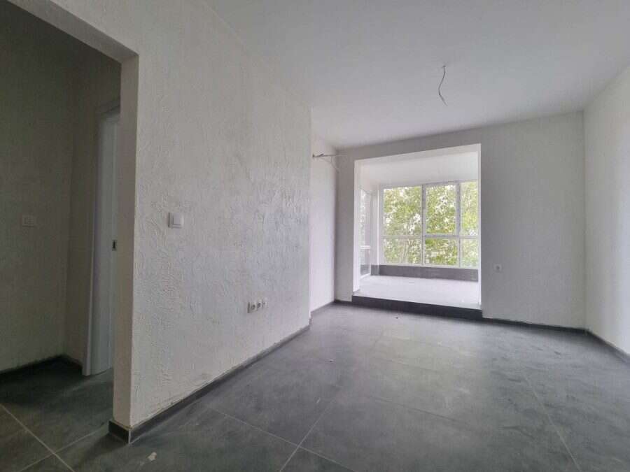 Interior view of a 1-bedroom top-floor apartment with spacious terrace in Villa Martini, close to th.