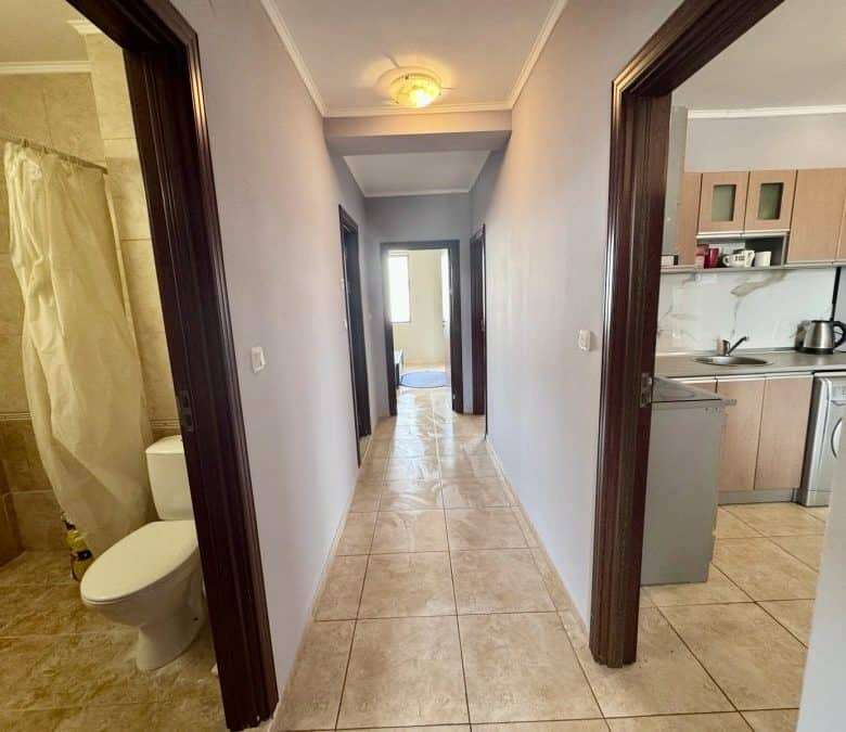 Interior view of a hallway with bathroom and kitchen in Apollon 5, Bulgaria.