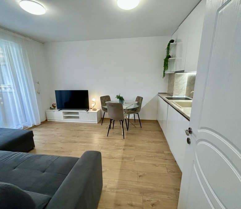 Apartment with pool views, modern interior, and open-plan living space in Aphrodite Green, Sunny Bea.