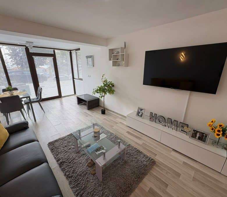 Bright living room with modern decor and large windows in Sveti Vlas.