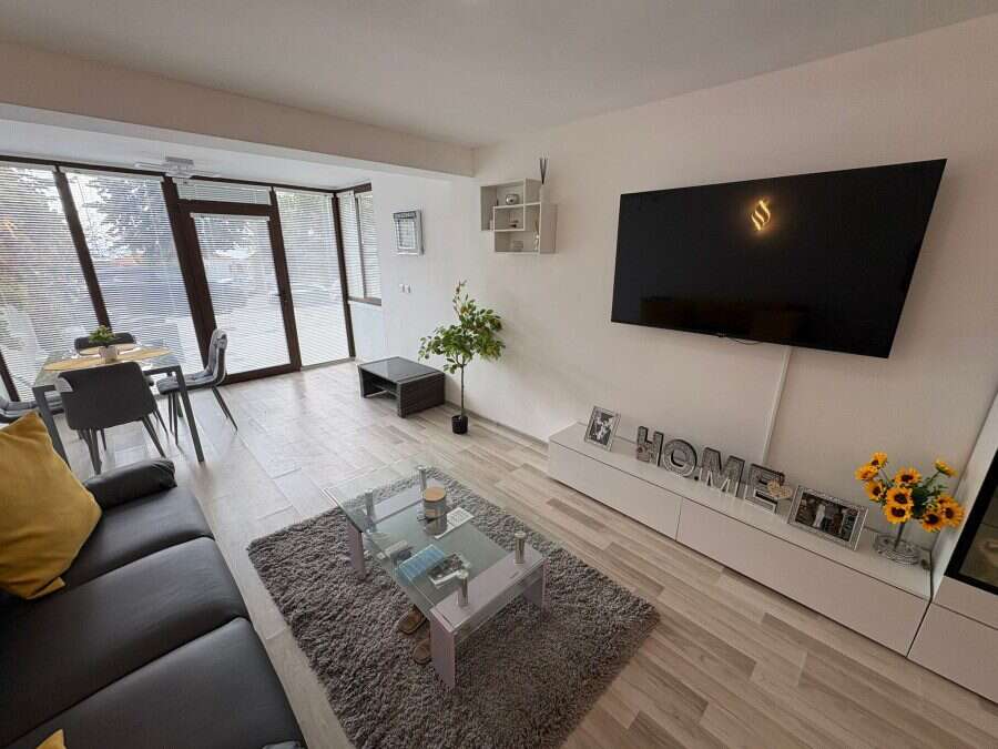 Bright living room with modern decor and large windows in Sveti Vlas.