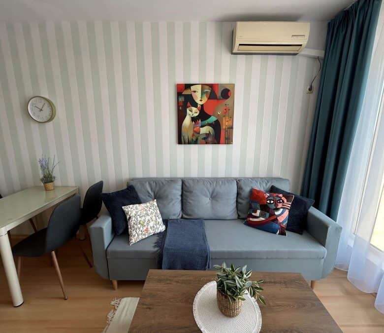 Elegant 1-bedroom top floor apartment with stylish furniture, bright living space, and 57 sq.m. area.