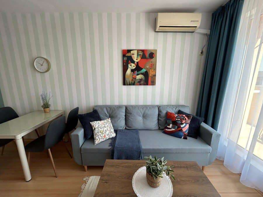 Elegant 1-bedroom top floor apartment with stylish furniture, bright living space, and 57 sq.m. area.