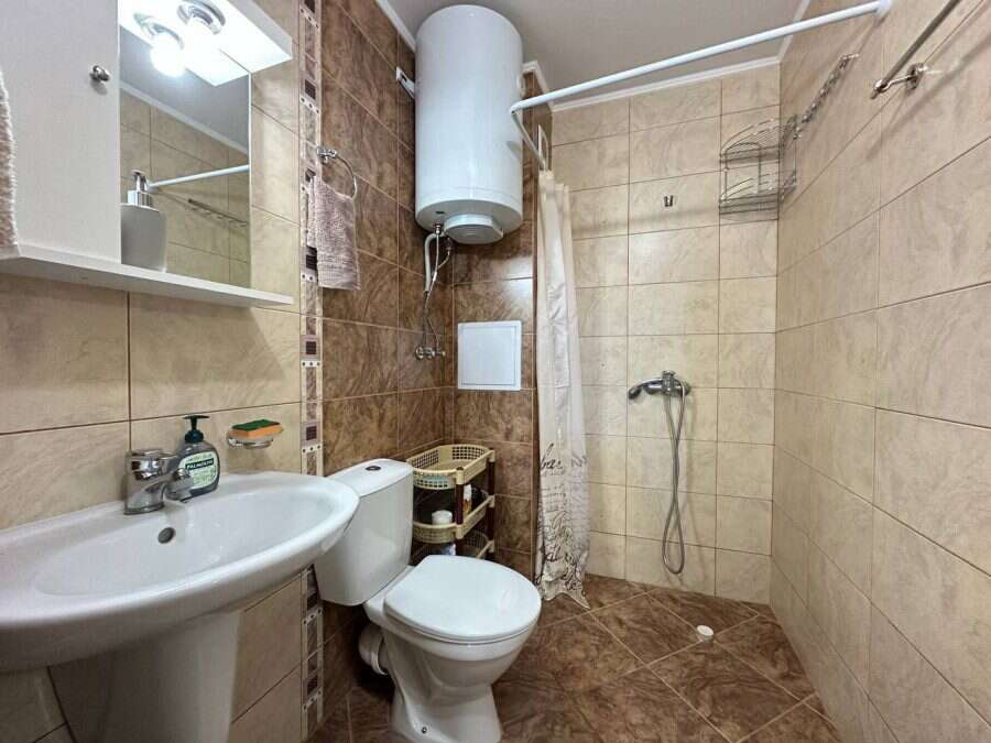 Cozy bathroom in Tarantula complex, Sunny Beach Bathroom with shower, toilet, and sink in a top-floor apartment.