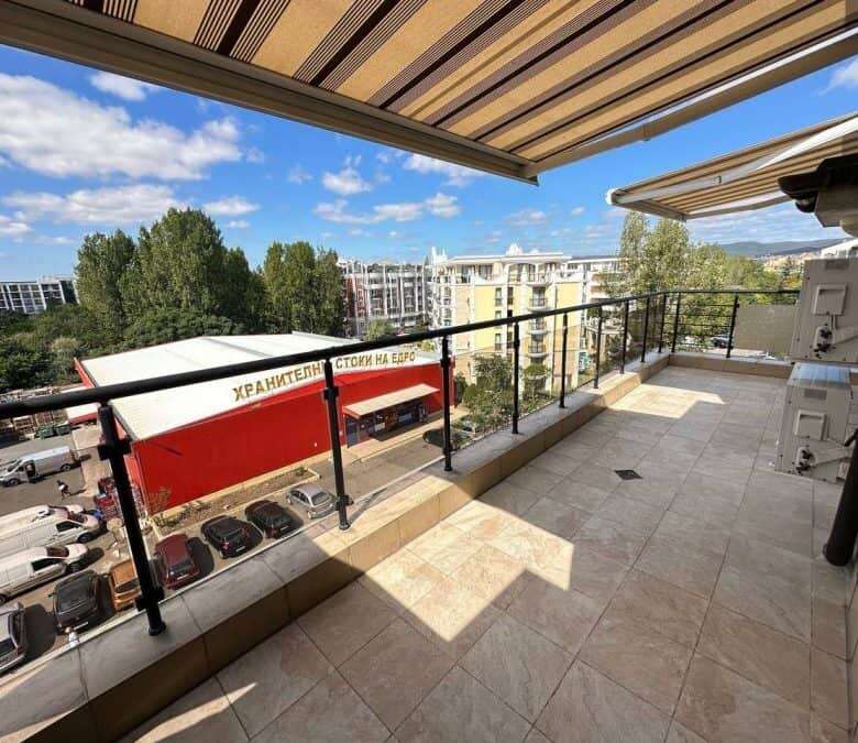 Spacious balcony of a 1-bedroom top floor apartment near the sea in Sunny Beach.