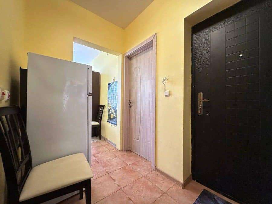 Interior view of a small 1-bedroom apartment in Nessebar, 300m from the sea, with simple furnishings.