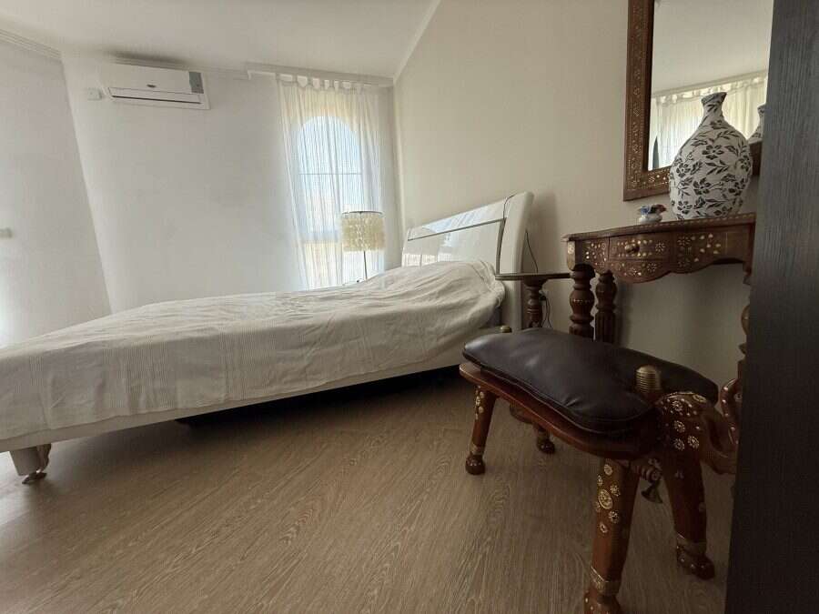 Bright bedroom with large window and sea views in Sveti Vlas apartment.