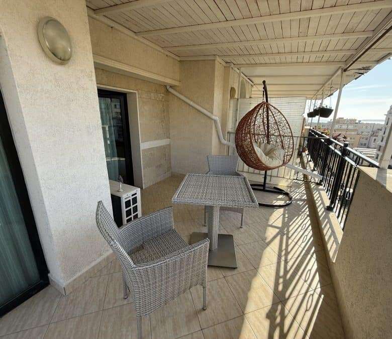 Seaside apartment balcony with outdoor furniture, large terrace, and stunning sea views in Sveti Vla.