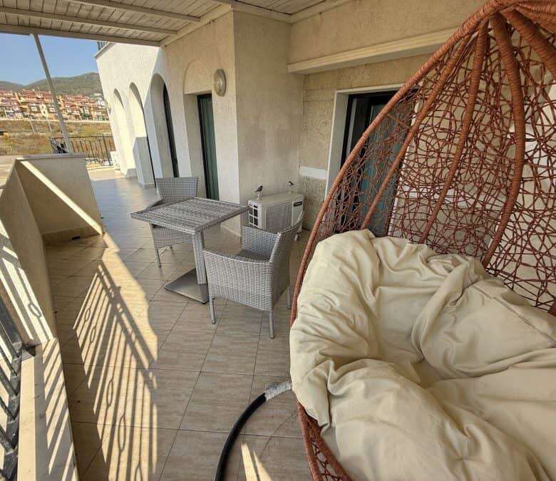 Sea view balcony with outdoor seating in Sveti Vlas.