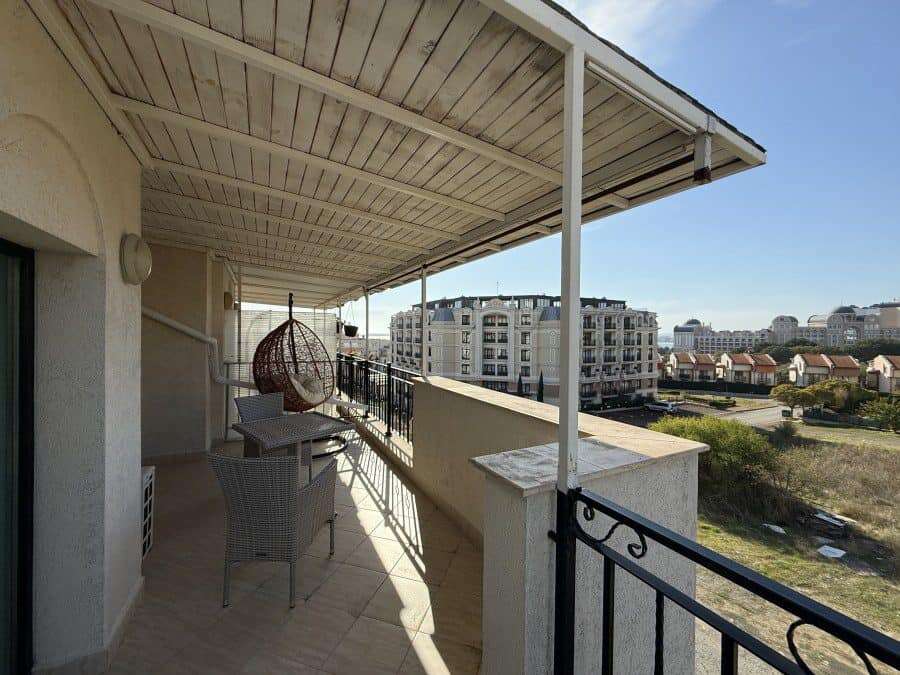 Balcony with sea views, spacious terrace, and outdoor seating in Sveti Vlas top-floor apartment.