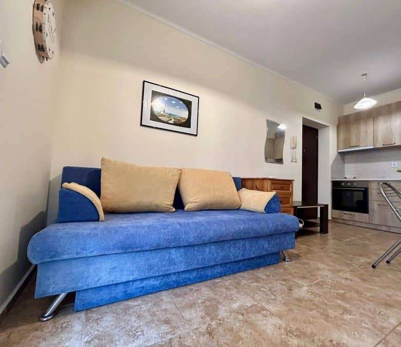 Apartment with blue sofa and modern kitchen in Ravda.