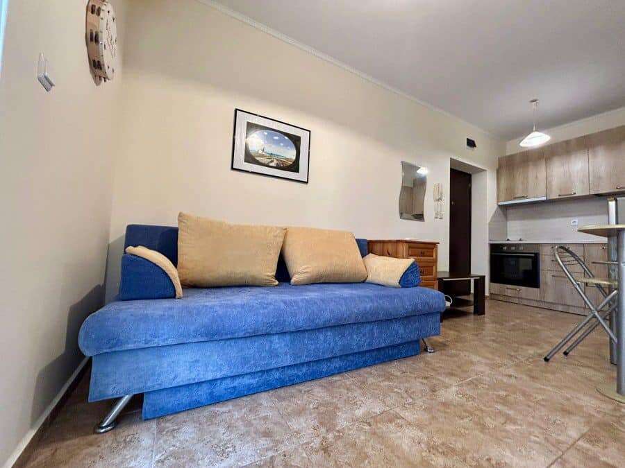 Apartment with blue sofa and modern kitchen in Ravda.