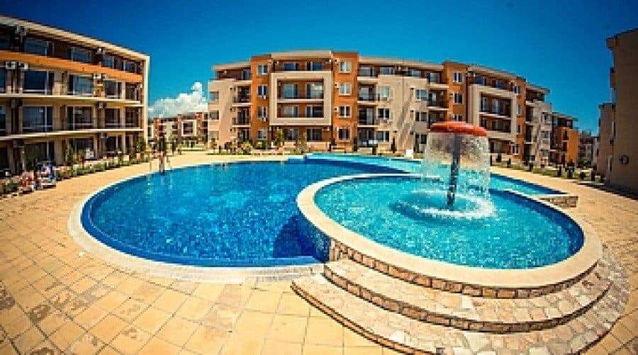 Bright outdoor pool area at Holiday Fort Club in Sunny Beach, Bulgaria.