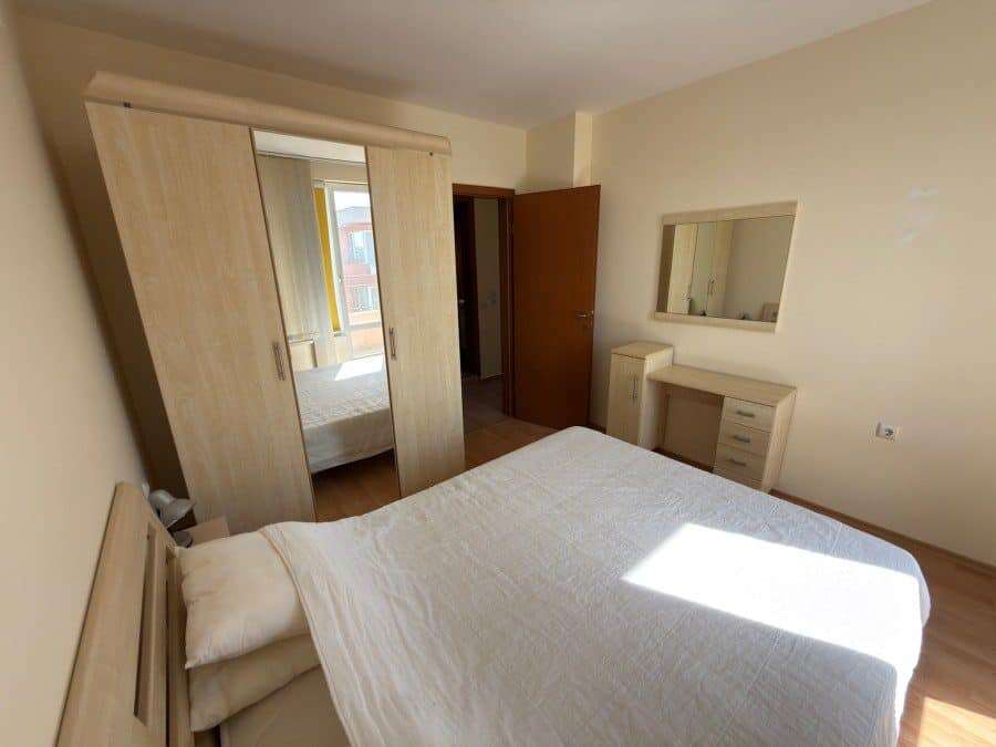 Cozy 2-bedroom top floor apartment in Sunny Beach near the sea, with bright interior and wardrobe.