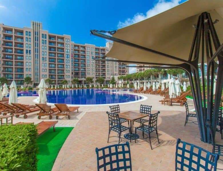 Poolside view with sun loungers and umbrellas at Barcelo Royal Beach.