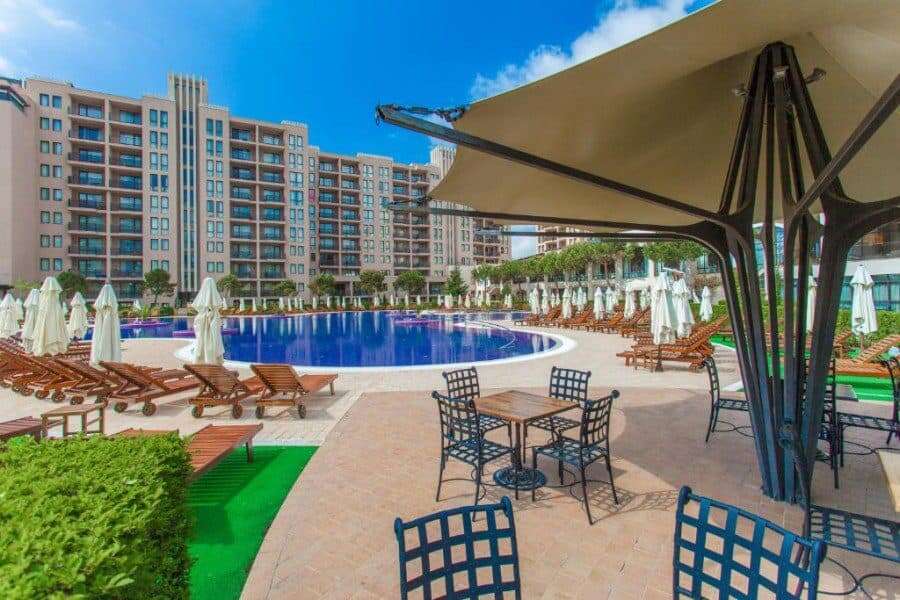Poolside view with sun loungers and umbrellas at Barcelo Royal Beach.