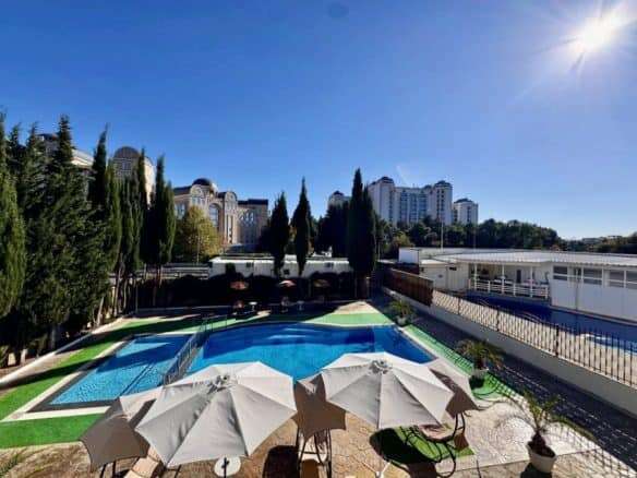 Pool view of a 1-bedroom apartment in Belle Air, Sveti Vlas, just 300m from the sea with sun lounger.
