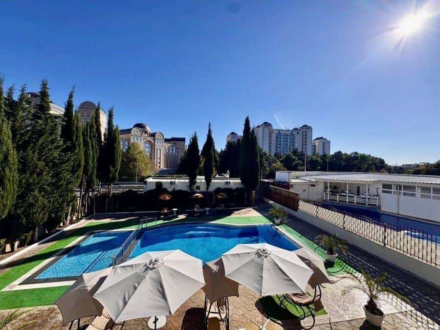 Pool view of a 1-bedroom apartment in Belle Air, Sveti Vlas, just 300m from the sea with sun lounger.