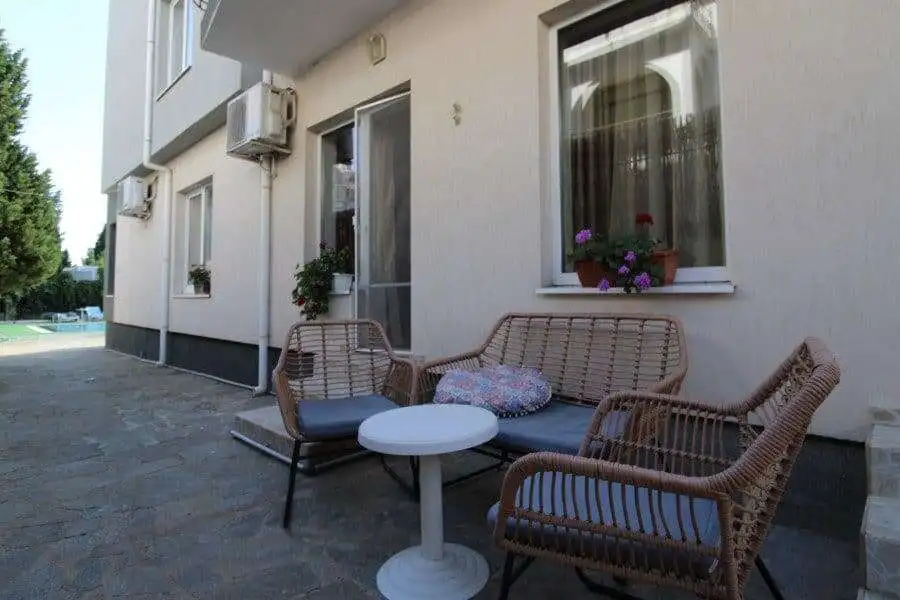 Ground floor 2-bedroom apartment near the sea in Sveti Vlas, Bulgaria, with outdoor seating area and.