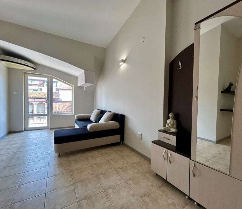 Bright living room with balcony access near the sea in Sveti Vlas.