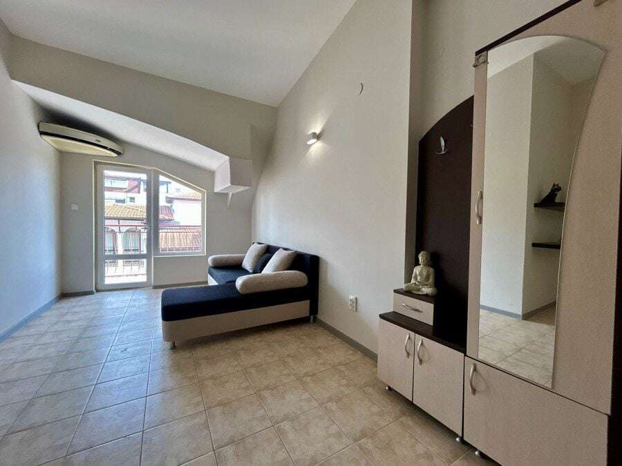Bright living room with balcony access near the sea in Sveti Vlas.