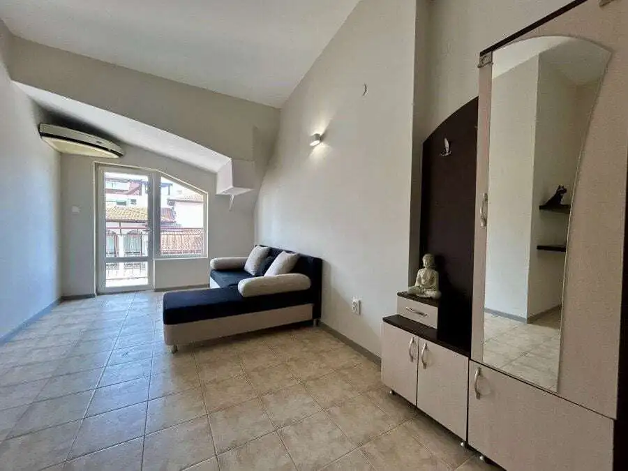 Bright living room with balcony access near the sea in Sveti Vlas.