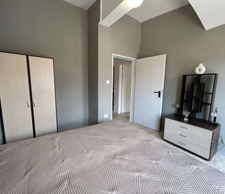 Bright interior of a 2-bedroom top floor apartment near the sea in Sveti Vlas. Spacious living area.