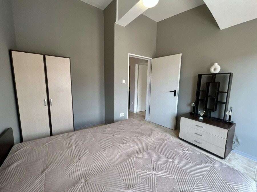 Bright interior of a 2-bedroom top floor apartment near the sea in Sveti Vlas. Spacious living area.