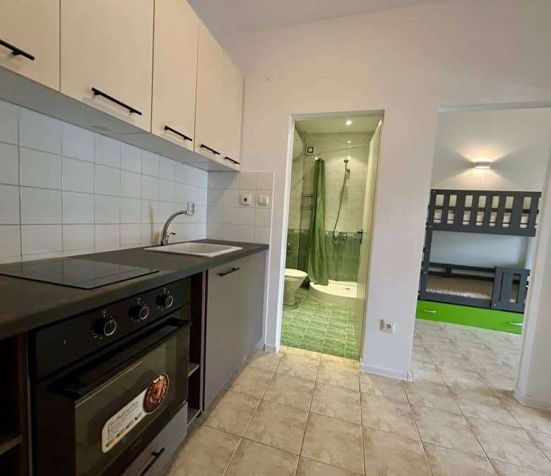 Bright interior of a 2-bedroom top floor apartment near the sea in Sveti Vlas. Modern kitchen, compa.