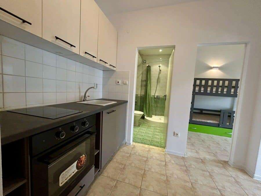 Bright interior of a 2-bedroom top floor apartment near the sea in Sveti Vlas. Modern kitchen, compa.