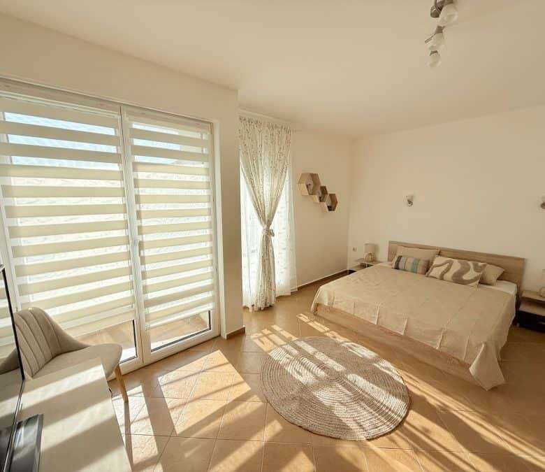 Apartment with spacious living area, large windows, and balcony near Sunny Beach.