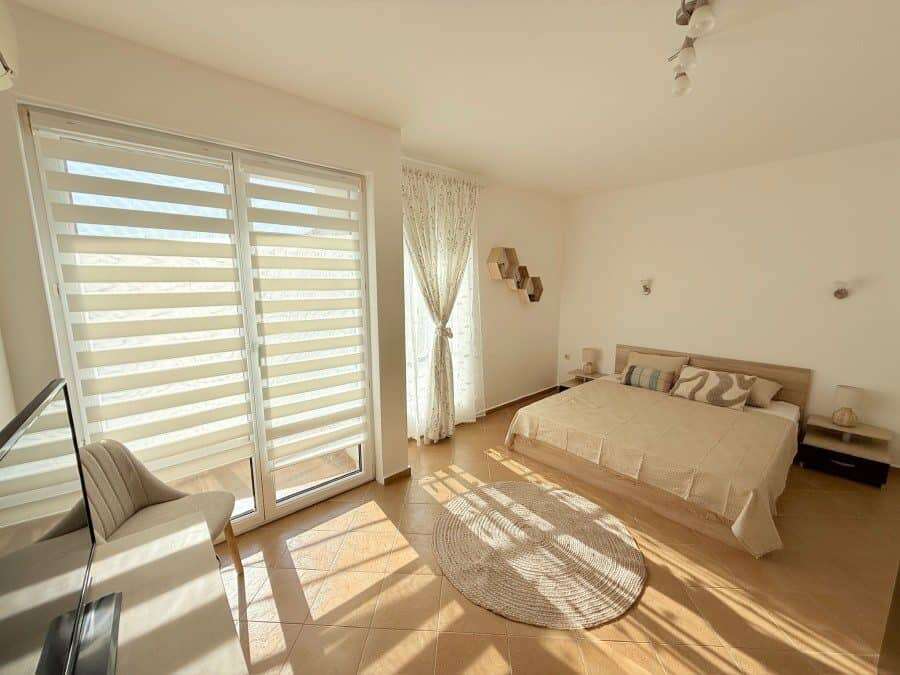 Apartment with spacious living area, large windows, and balcony near Sunny Beach.