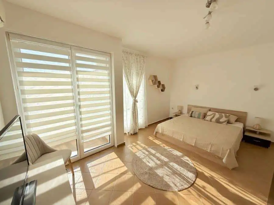 Apartment with spacious living area, large windows, and balcony near Sunny Beach.