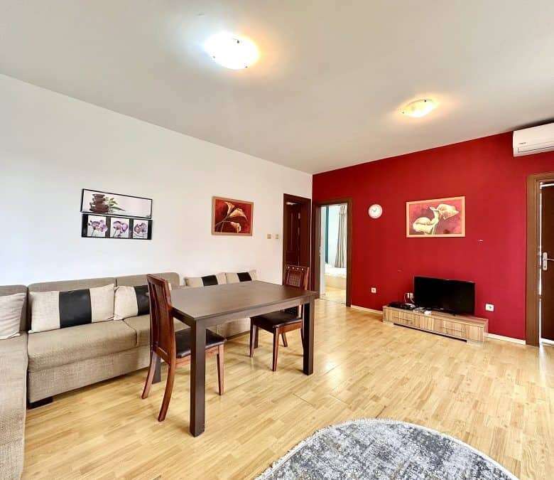 Bright living room with stylish decor and wooden flooring near the sea.