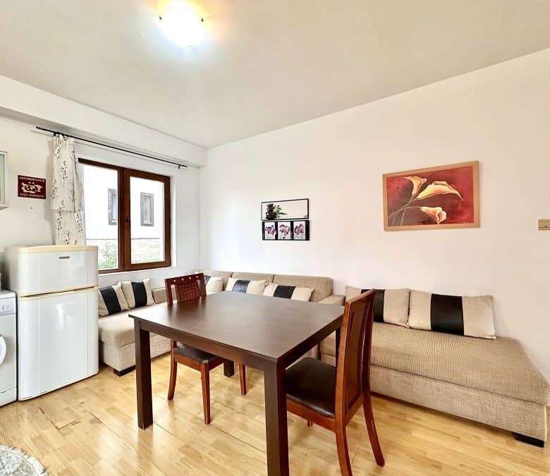 Bright living room with sofa and dining area, near the sea in Panorama Bay 1.