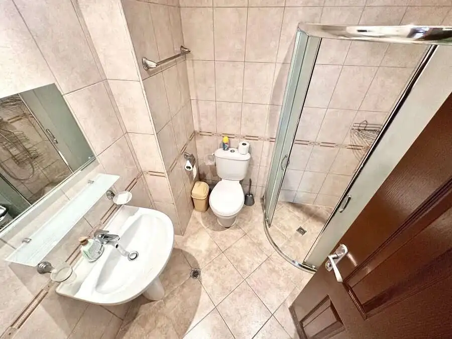 Bright bathroom with shower cabin and modern fixtures in Panorama Bay 1.