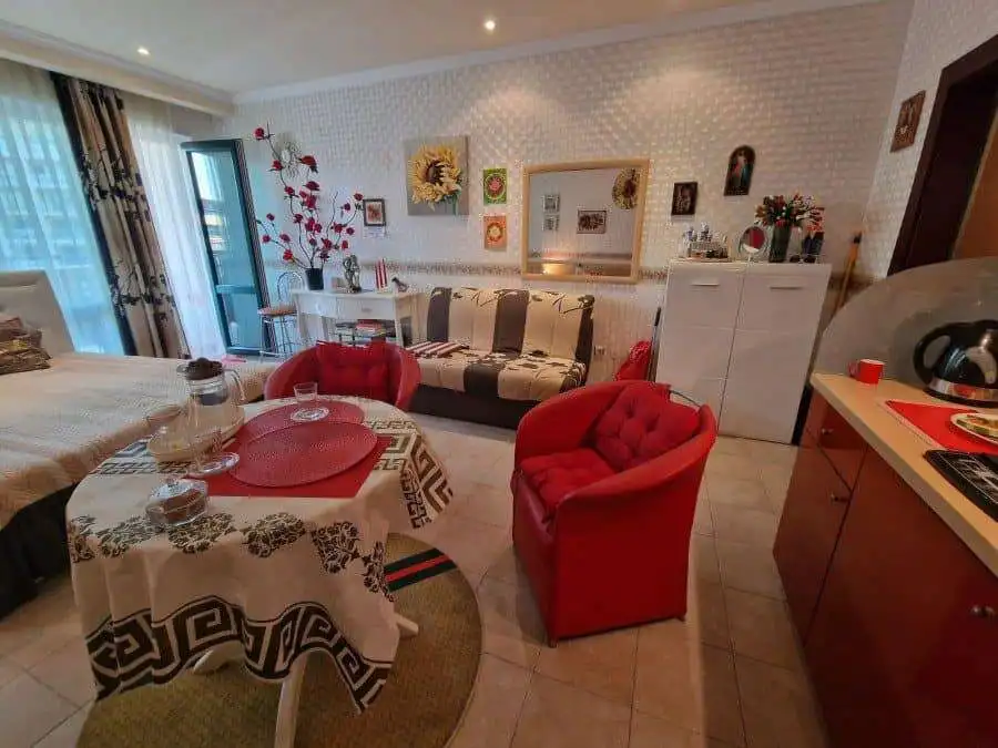 Sunny Beach studio living area with colorful decor and modern furnishings.