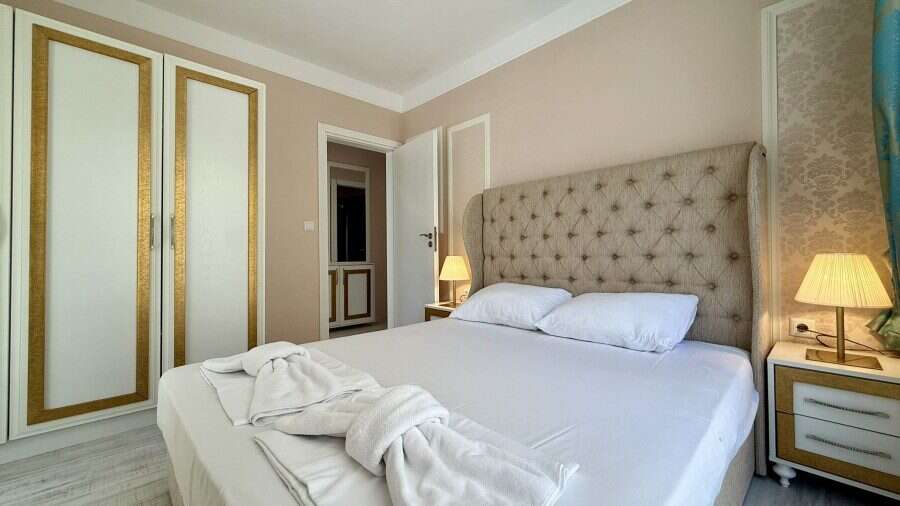 Luxury 1 Bed Apartment in Sunny Beach Spacious bedroom with elegant decor in Harmony Suites, Monte Carlo.