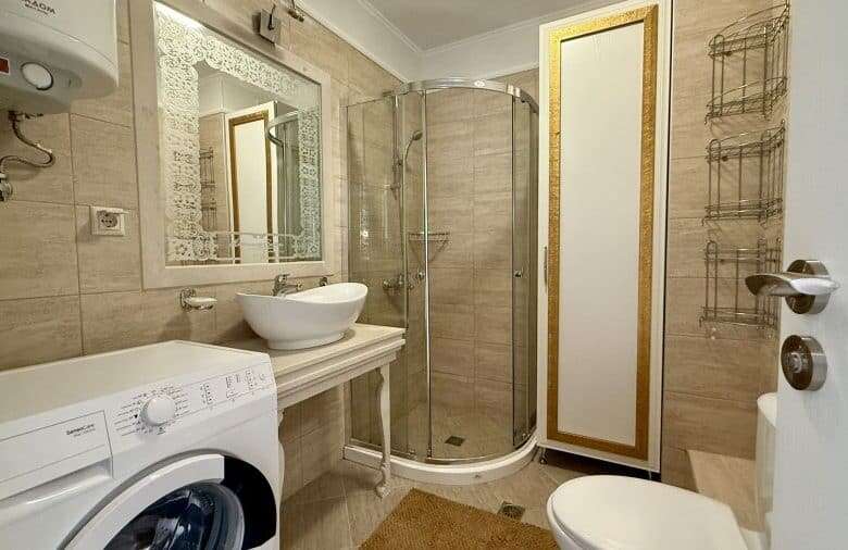 Bright bathroom with shower in Harmony Suites, Monte Carlo.