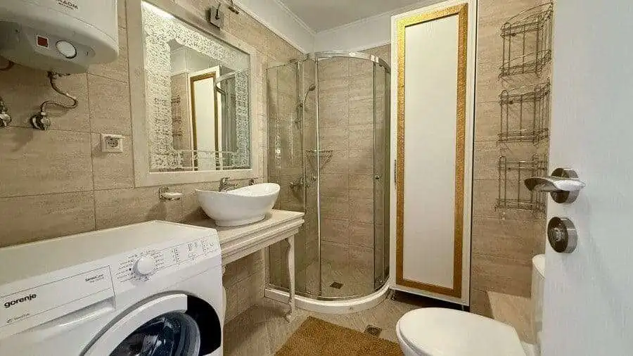 Bright bathroom with shower in Harmony Suites, Monte Carlo.