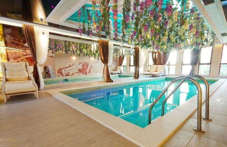 Elegant indoor swimming pool in luxury Harmony Suites, Monte Carlo, Sunny Beach.